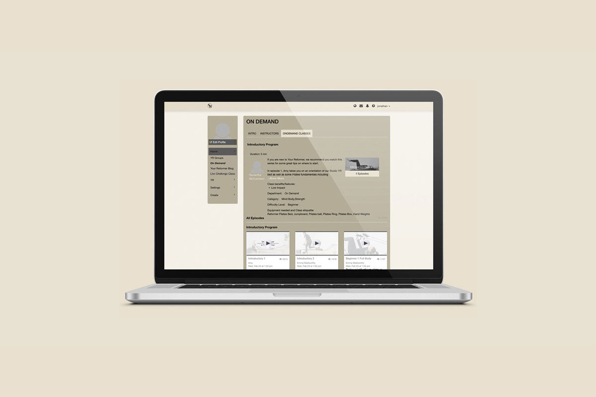 Silver MacBook Pro showing Your Reformer OnDemand Class Library - Desktop View | Your Reformer