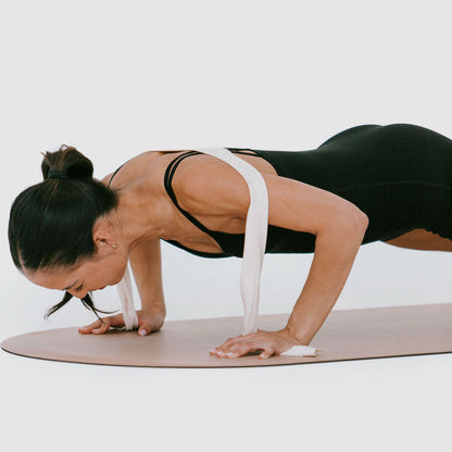 Ivory Stretch Resistance Band worn across back in Pilates plank pose - On Model | Your Reformer