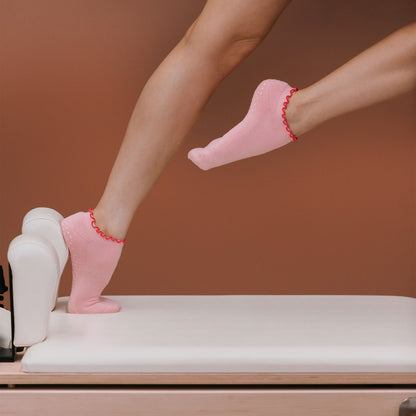 Hot Pink Ankle Grip Socks - On Model Pilates Pose | Your Reformer