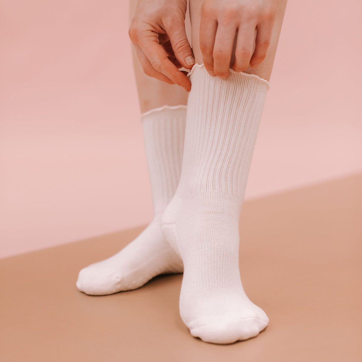 White Crew Grip Socks - On Model Hands Detail | Your Reformer