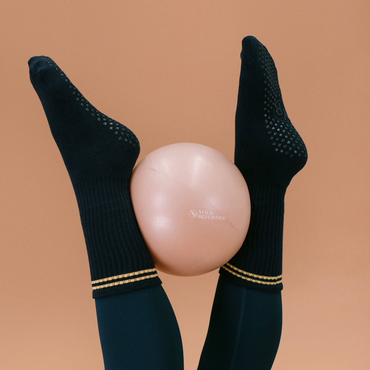 Navy Crew Grip Socks - Worn on Feet with Pilates Ball | Your Reformer