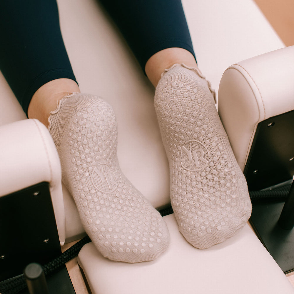 Nude Ankle Grip Socks - Sole View with Pilates Equipment | Your Reformer