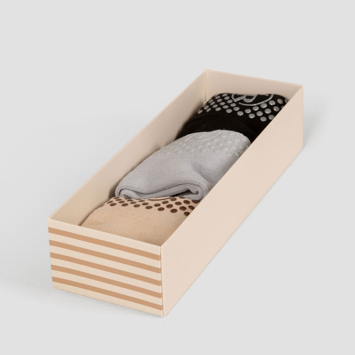 Neutral Ankle Grip Sock Essentials Bundle - Flat Lay in Wooden Box | Your Reformer