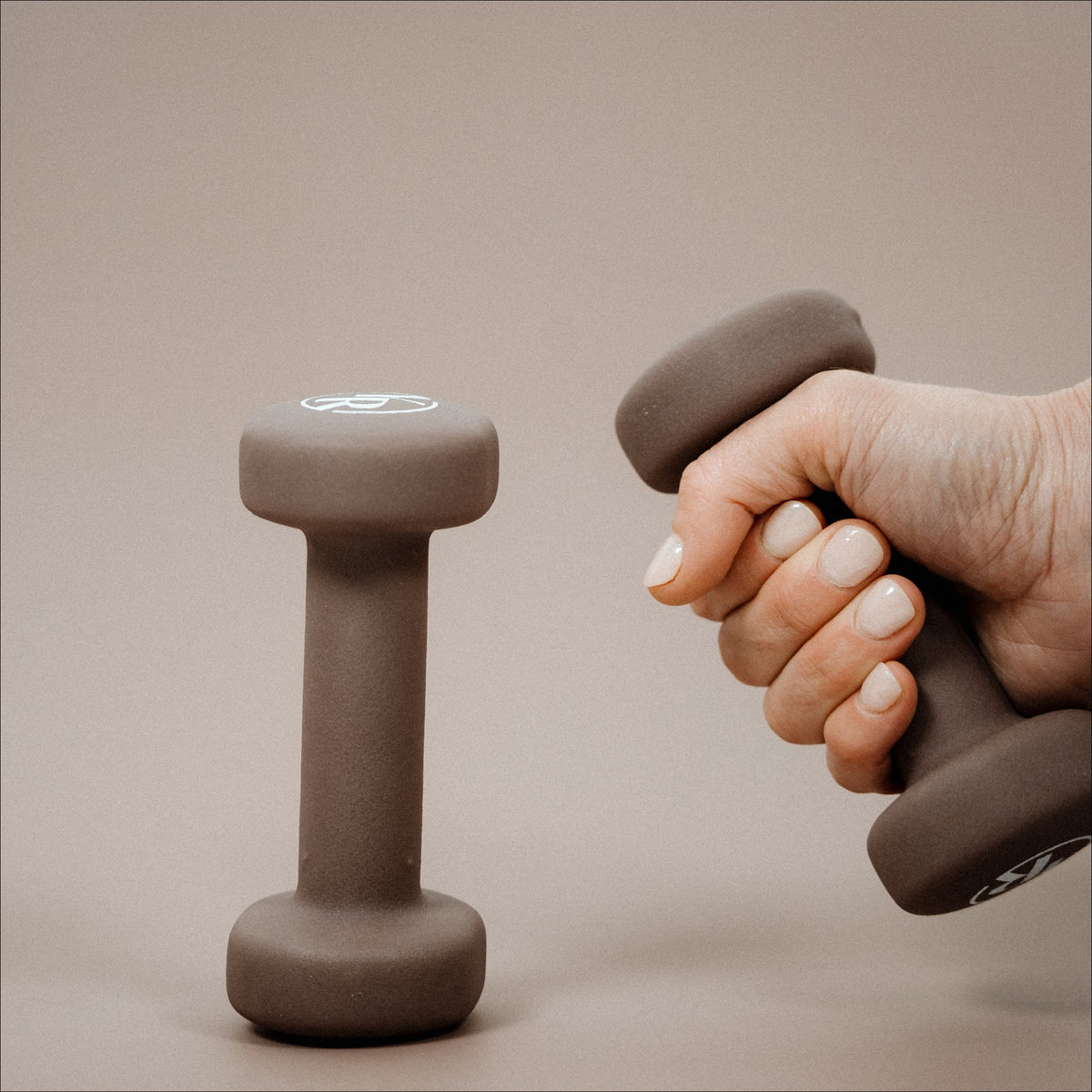 Mocha Pilates Weights in Hand - Grip Detail | Your Reformer