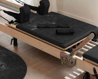 Black Wash Pilates Pack with Reformer Mat and Ankle Weights on Pilates Reformer | Your Reformer