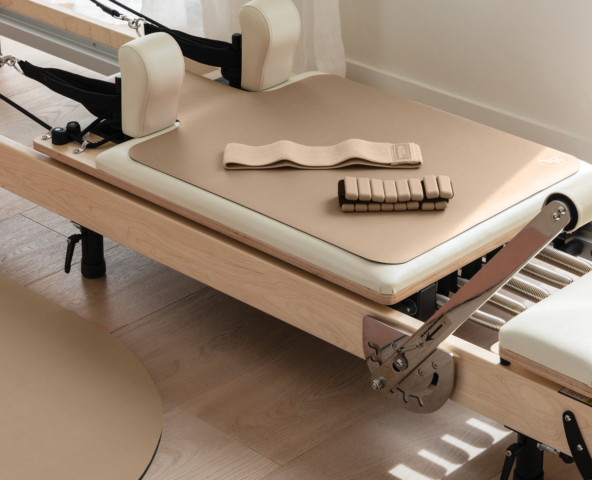 Mocha Pilates Pack with Reformer Mat and Ankle Weights on Pilates Reformer | Your Reformer