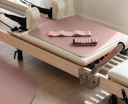 Blush Pilates Pack with Reformer Mat and Ankle Weights on Pilates Reformer | Your Reformer
