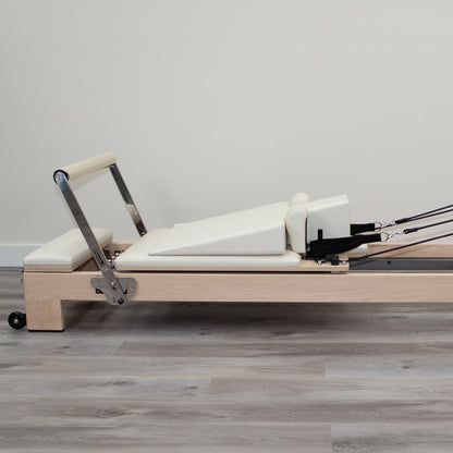 Ivory Pregnancy Wedge on Pilates Reformer - Side Profile | Your Reformer