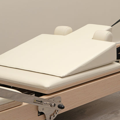 Ivory Pregnancy Wedge on Pilates Reformer - Top View | Your Reformer