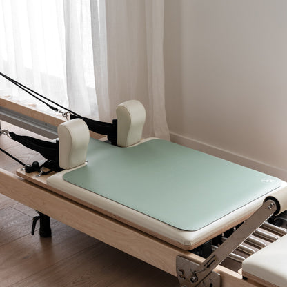 Sage Green Non Slip Reformer Mat on Pilates Equipment - Lifestyle View | Your Reformer