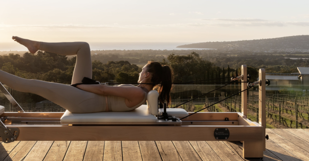 Wood Pilates Reformer Machine - Outdoor Studio Setup Side View | Your Reformer