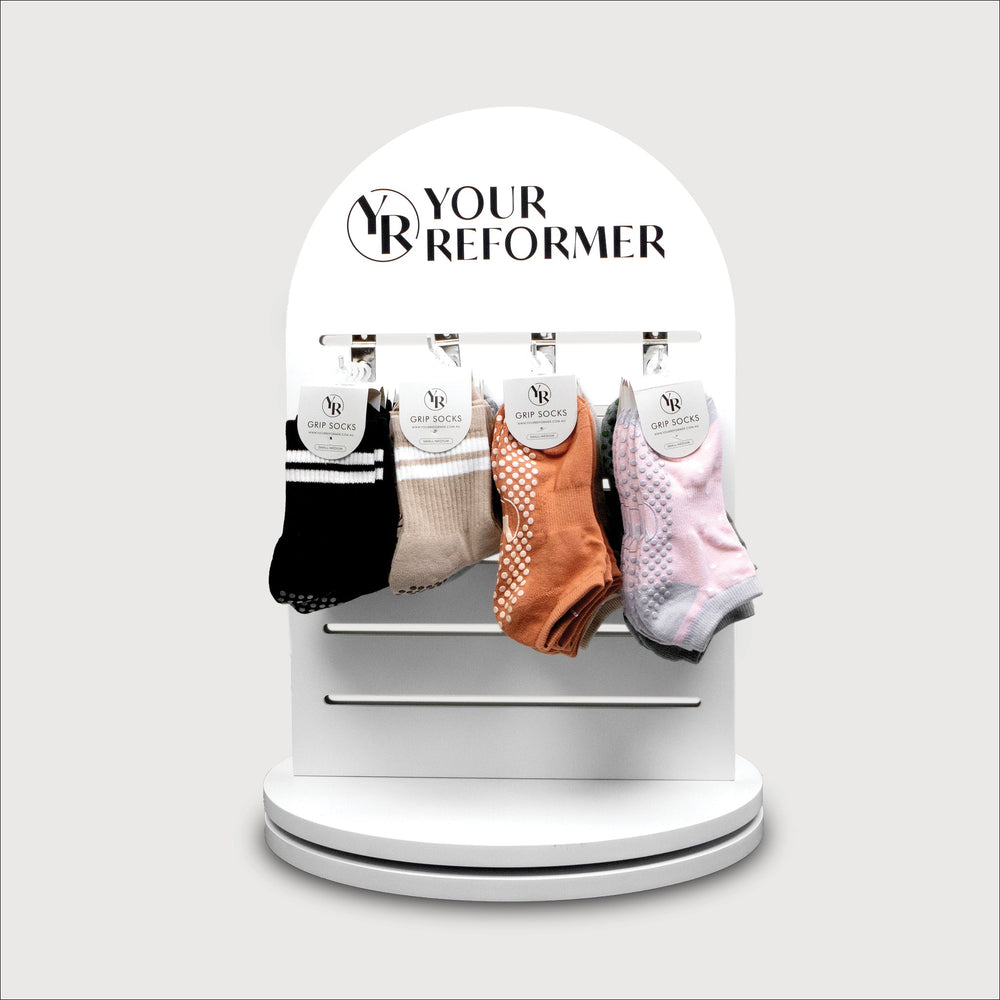 White Arch Swivel Stand with Grippy Socks & Resistance Bands Display - Front View | Your Reformer