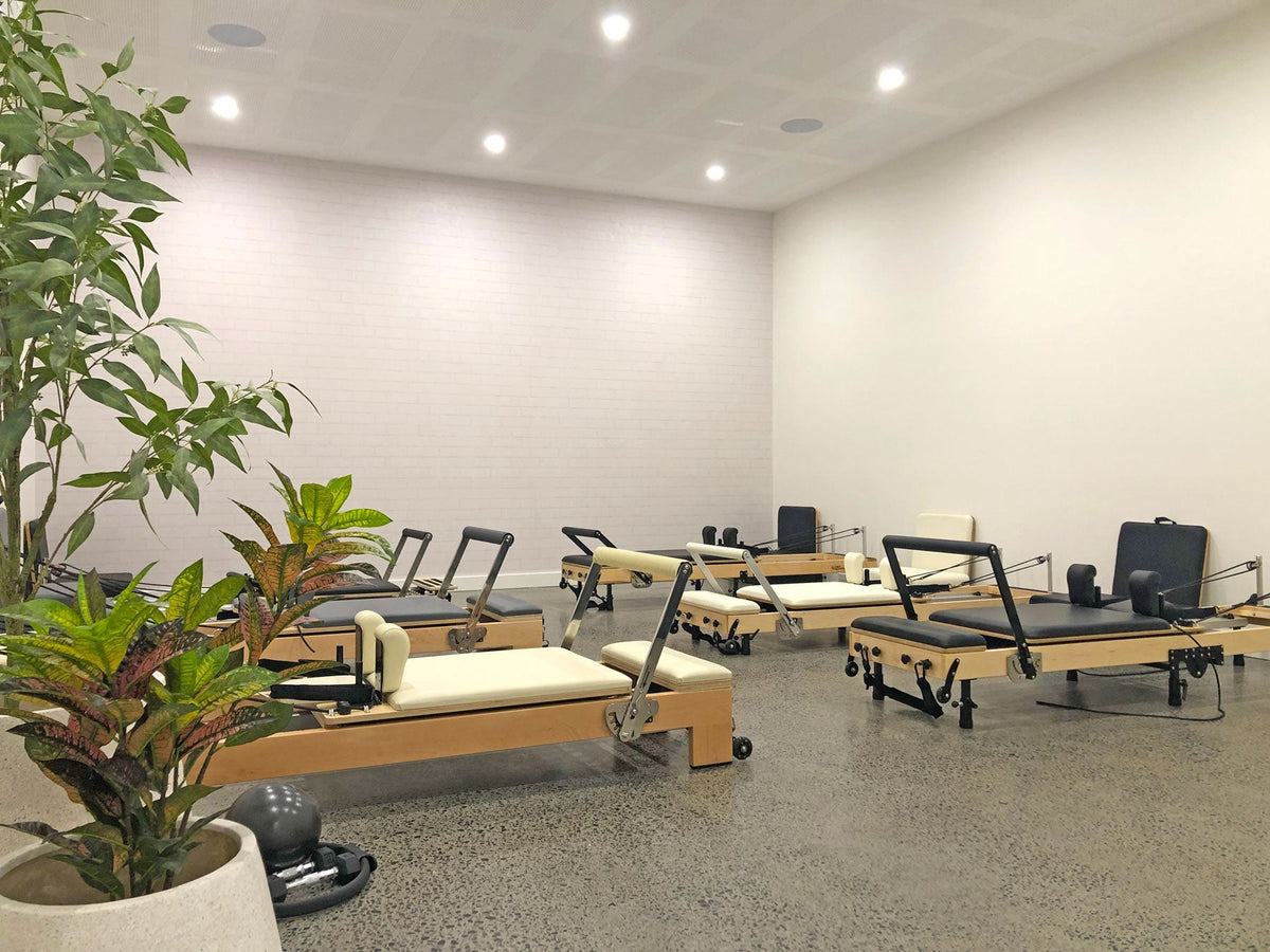 Modern Pilates Studio Interior with Wood Reformers - Showroom View Mornington | Your Reformer