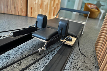 Black Studio X Reformer - Shoulder Blocks and Carriage Assembly Side View | Your Reformer